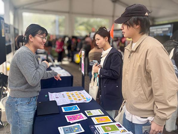 Orientation day at university. Students at booth.